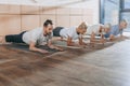 group of people doing plank on yoga mats Royalty Free Stock Photo