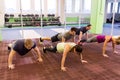 Group of people doing push-ups in gym Royalty Free Stock Photo