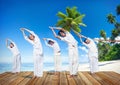 Group of People Doing Yoga on Beach Royalty Free Stock Photo