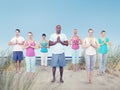 Group of People Doing Yoga at Beach Royalty Free Stock Photo