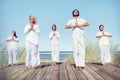 Group of People Doing Yoga on Beach Royalty Free Stock Photo