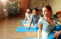 group of people doing yoga exercises at studio Royalty Free Stock Photo
