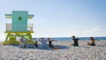 group of people doing yoga during sunrise on the beach at Miami Florida South Beach Royalty Free Stock Photo