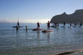 A group of people dressed as santa claus doing paddle in the Poetto beach in Cagliari - Sardinia - ITALY 2022 DECEMBER