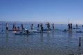 A group of people dressed as santa claus doing paddle in the Poetto beach in Cagliari - Sardinia - ITALY 2022 DECEMBER