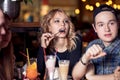 Friends having a coffee together. women and man at cafe, talking, laughing Royalty Free Stock Photo