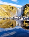 Group of people enjoying the stunning view of a cascading waterfall, Reykjavik, Golden Circle Royalty Free Stock Photo