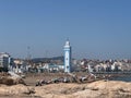 Group of people enjoying their summer holiday on the beach nearby Mohammed VI mosque in Fnideq