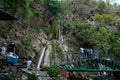 Group of people enjoying under the famous neer garh Waterfall, Rishikesh, Uttarakhand India