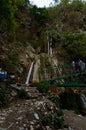 Group of people enjoying under the famous neer garh Waterfall, Rishikesh, Uttarakhand India