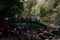 Group of people enjoying under the famous neer garh Waterfall, Rishikesh, Uttarakhand India