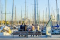 Group of people is enjoying view of port Vell in Barcelona, Spain...IMAGE