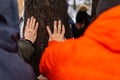The people standing around a tree and putting their hands on it Royalty Free Stock Photo