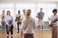 Group Of People In Exercise Clothing Meeting For Fitness Or Yoga Class In Community Center Royalty Free Stock Photo