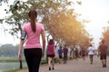 Group of people exercise walking in the park