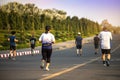 Group of people exercise walking in the park