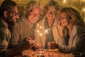 Group of people and family celebrating some party or new year together at the terrace of the home - four sparklers at the middle