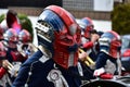 Group of people in festive masks participating in a traditional carnival parade in Deizisau, Germany