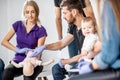 Group of people during the first aid training for baby Royalty Free Stock Photo