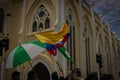 Group of people with flags waving in the streets of Cartagena, Colombia. Royalty Free Stock Photo