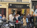Group of people gathered in an outdoor area, waiting in line outside Les Choupettes de ChouChou