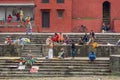 Group of people gathered on the stairs of the temple