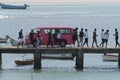 Group of people gathering on a pier on a sunny day in Sal Rei, Cabo Verde