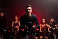 Group of people in the gym, exercising their legs doing cardio training Royalty Free Stock Photo