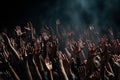 Group of people hands raised up in the air on a black background Royalty Free Stock Photo