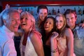 Group Of People Having Fun In Busy Bar Royalty Free Stock Photo