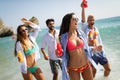 Group of happy people having fun at summer. Beach vacation friends travel concept