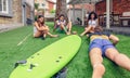 Group of people having fun in a surf class Royalty Free Stock Photo