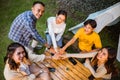 a group of people high fived above the wood table