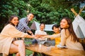 a group of people high fived and smiling together