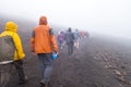 People hiking on hawaii, maui, haleakalÃÂ mountain trail with cloud mist