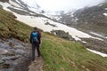 Group of people hiking and mountain snow panorama in Tyrol Alps, Austria
