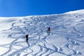 Group of people hiking on snowshoes and mountain snow panorama with blue sky in Stubai Alps Royalty Free Stock Photo