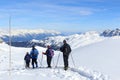 Group of people hiking on snowshoes and mountain snow panorama with blue sky in Stubai Alps Royalty Free Stock Photo