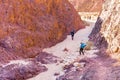 Group people hiking walking stone desert trail backpacking travel