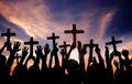 Group of People Holding Cross and Praying in Back Lit Royalty Free Stock Photo