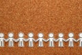 Group of people holding hands on bulletin board. Teamwork concept. Royalty Free Stock Photo