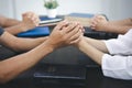 group of people holding hands in remembrance of god On the table there is a Bible, Respect, Spirituality and Religion. Christian Royalty Free Stock Photo