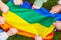 Group of people holding rainbow pride flag in a hands, gay and lesbian concept, LGBTQ Royalty Free Stock Photo
