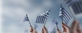 A group of people holding small flags of the Greece in their hands Royalty Free Stock Photo