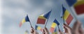 A group of people holding small flags of the Romania in their hands Royalty Free Stock Photo