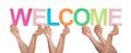 Group Of People Holding The Word Welcome Royalty Free Stock Photo