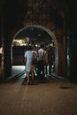 group of people walking through an arched doorway inside Fort Santiago Royalty Free Stock Photo