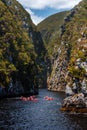 A group of people in Kayaks setting in Storms River Mouth, South Africa