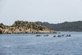 A group of people in kayaks travels near the Kekova Island. Tourists kayaking in the Mediterranean Sea Royalty Free Stock Photo