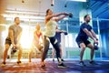 Group of people with kettlebells exercising in gym Royalty Free Stock Photo